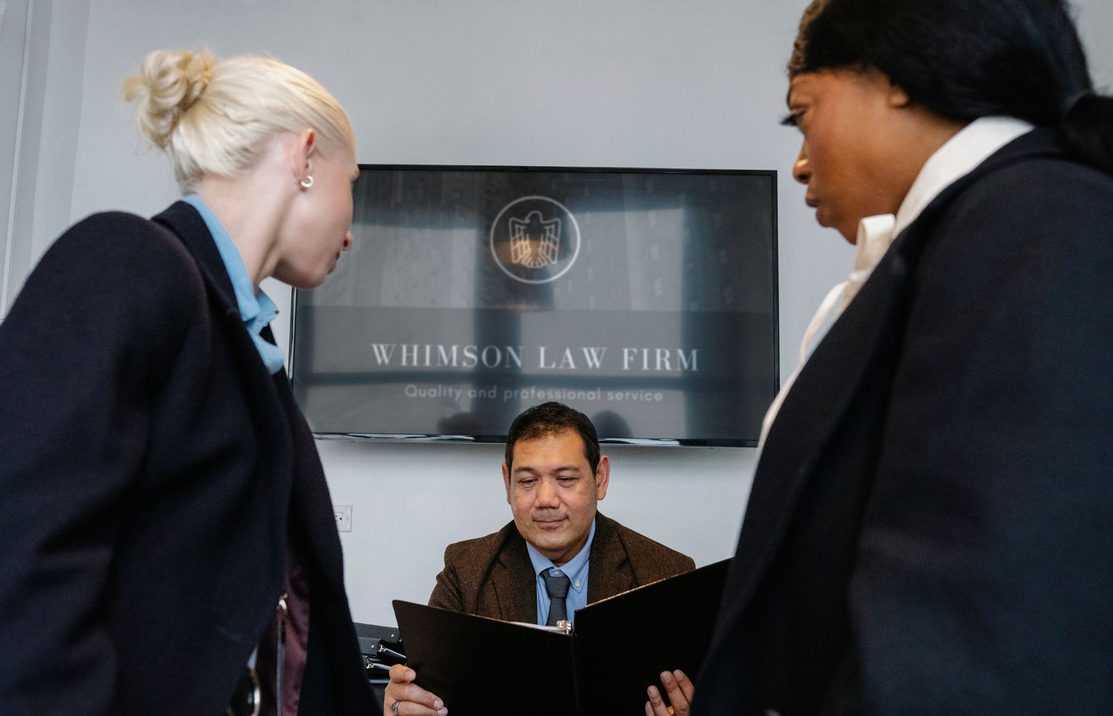 Attorneys meeting in a law firm lobby